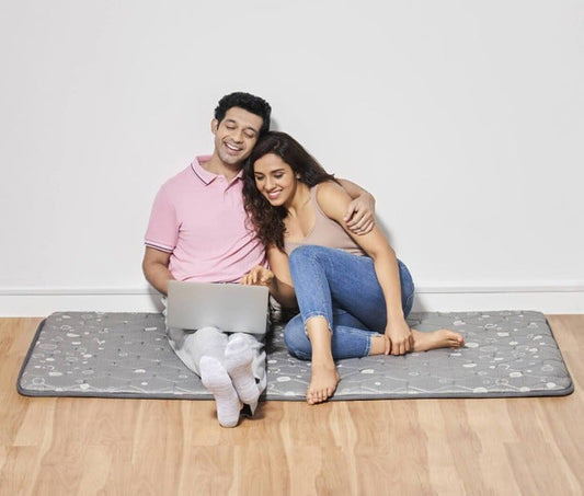 Flexi Lightweight Travel Friendly Slim Mattress - Grey - Couple Sitting with Laptop - Duroflex